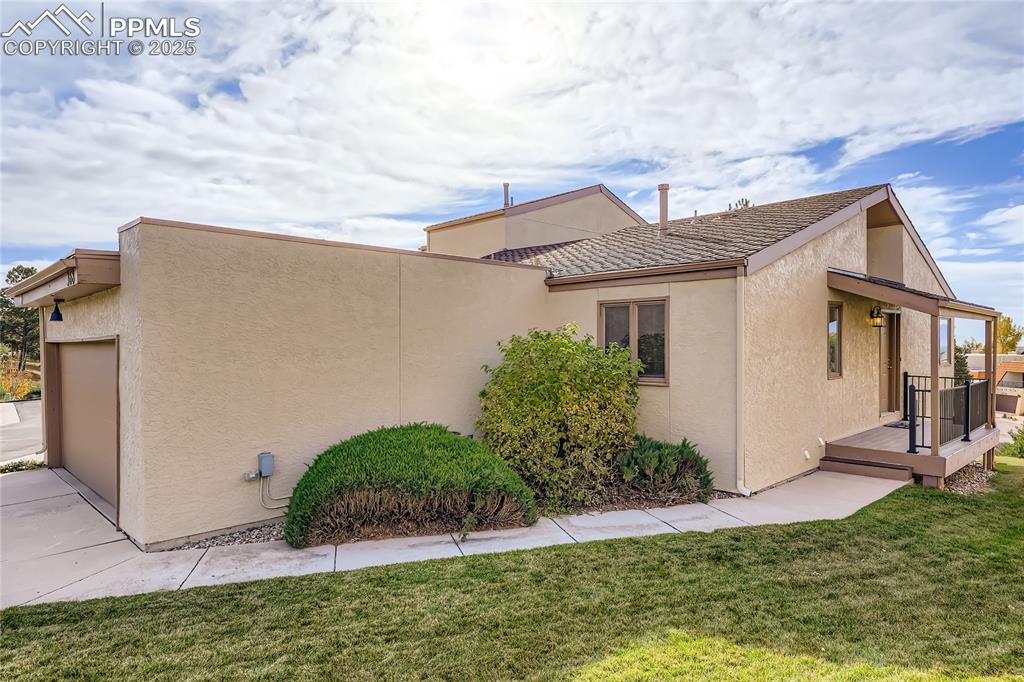 368 Mission Hill Way Colorado Springs, CO 80921 - Photo 3 of 39 a view of a white house next to a yard with potted plants