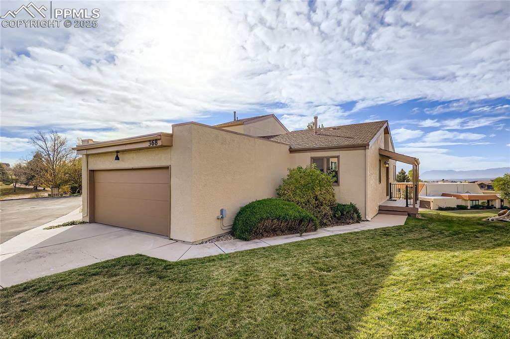368 Mission Hill Way Colorado Springs, CO 80921 - Photo 39 of 39 front view of a house with a yard