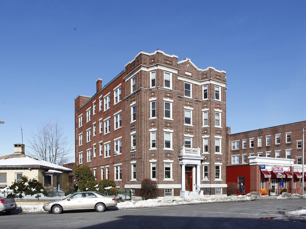 a front view of a building with street view