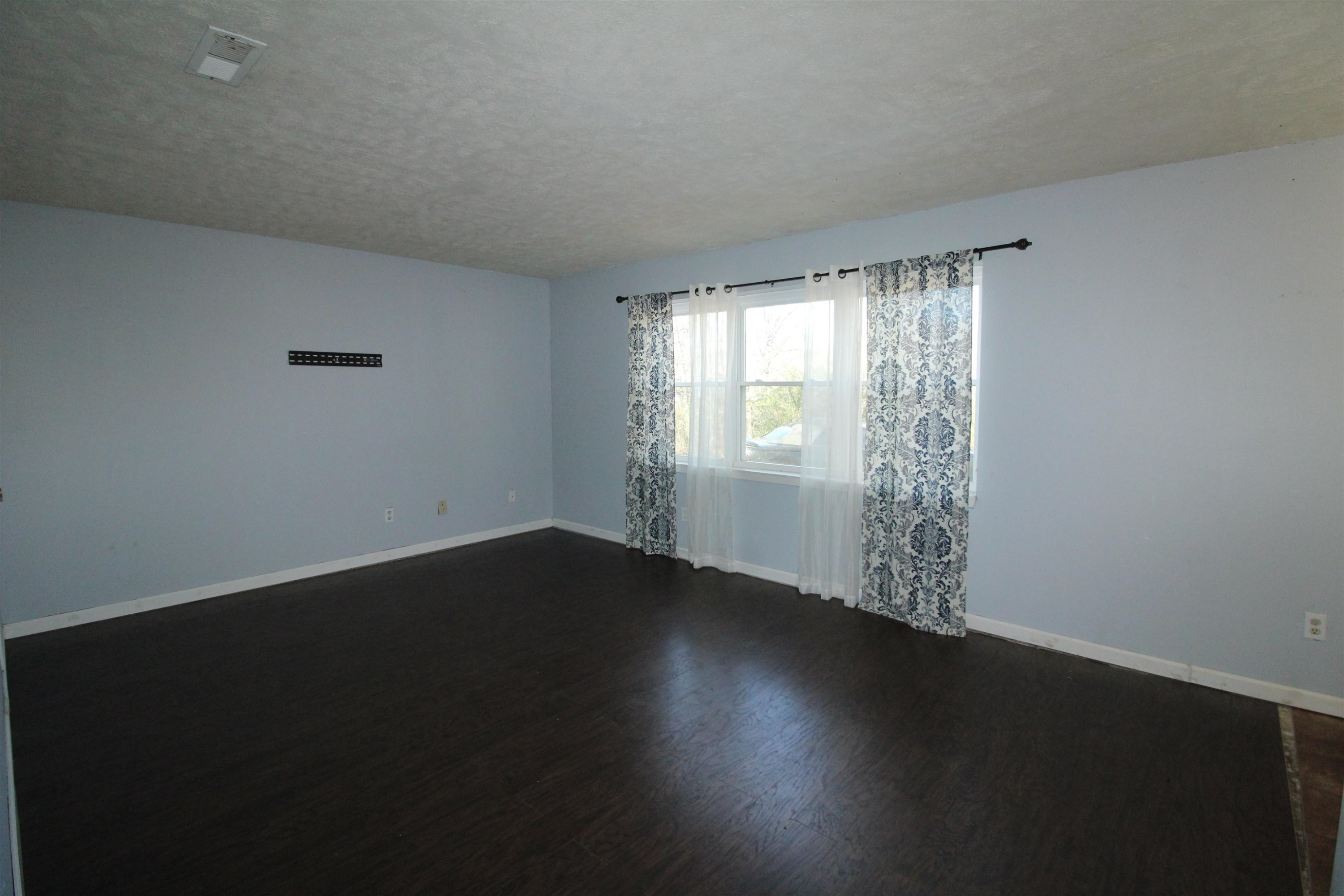 410 Lowery Road Medon, TN 38356 - Photo 2 of 24 a view of wooden floor and windows in a room