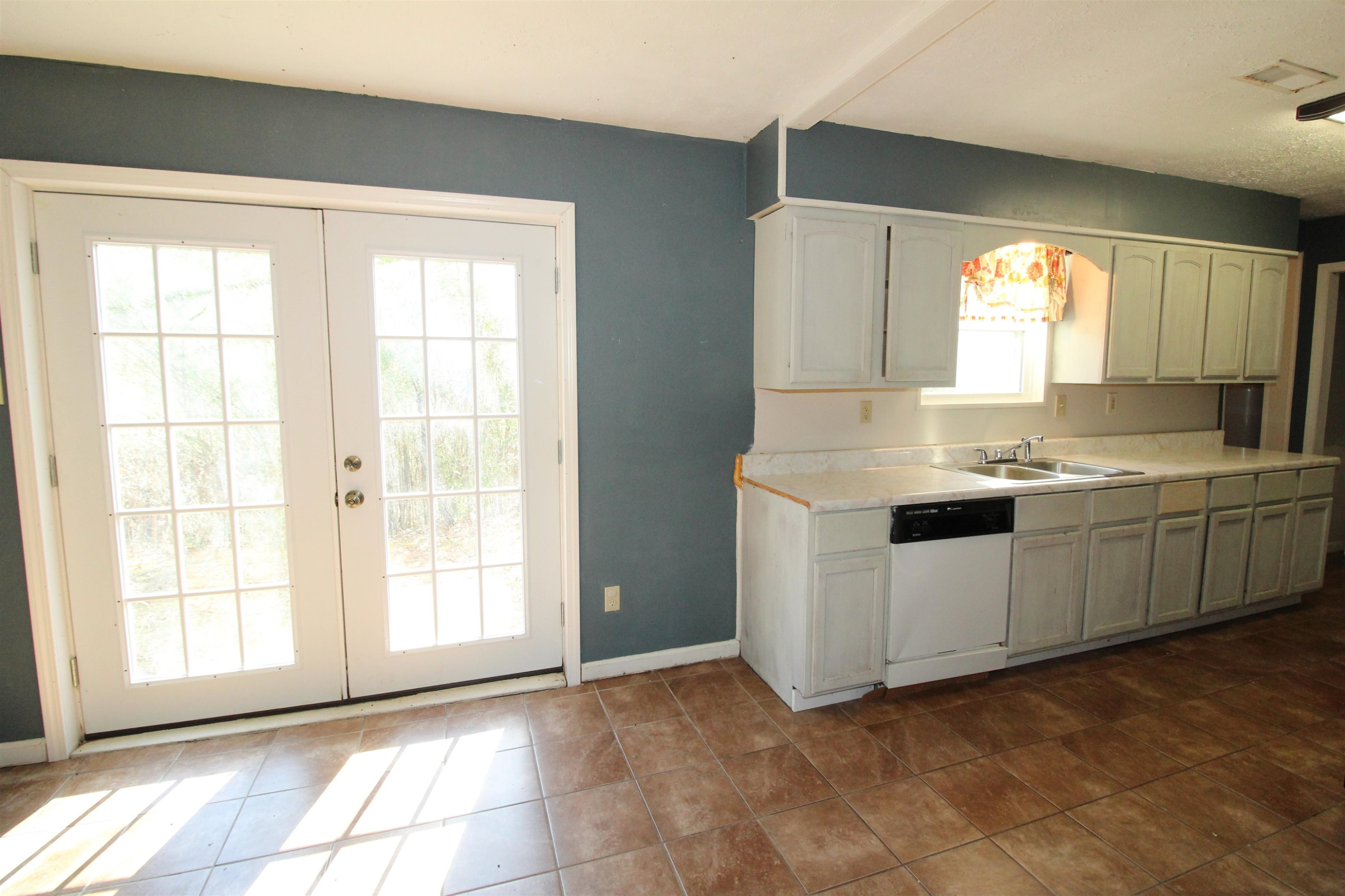 410 Lowery Road Medon, TN 38356 - Photo 7 of 24 a kitchen with a sink cabinets and window