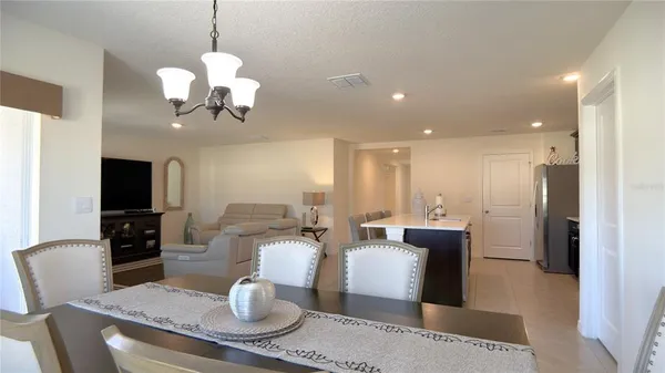 a view of a dining room with furniture window and outside view