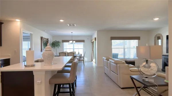 a kitchen with stainless steel appliances a microwave sink refrigerator and cabinets