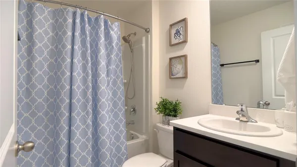 a bedroom with bed and flat screen tv