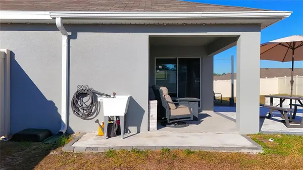 a bed room with a bed and a chair