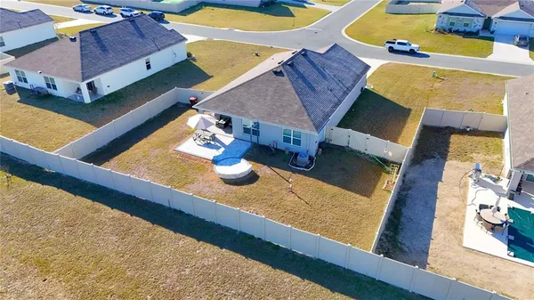 an aerial view of a house with patio