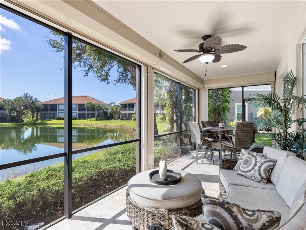 10260 Glastonbury Circle, Unit 102 Fort Myers, FL 33913 - Photo 14 of 44 a living room with furniture and a floor to ceiling window