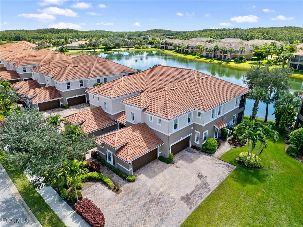 10260 Glastonbury Circle, Unit 102 Fort Myers, FL 33913 - Photo 2 of 44 an aerial view of residential houses with outdoor space and river