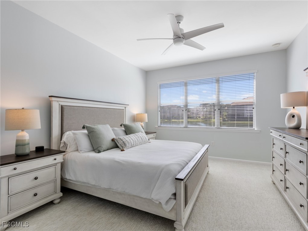 10260 Glastonbury Circle, Unit 102 Fort Myers, FL 33913 - Photo 25 of 44 a bedroom with a bed and a window