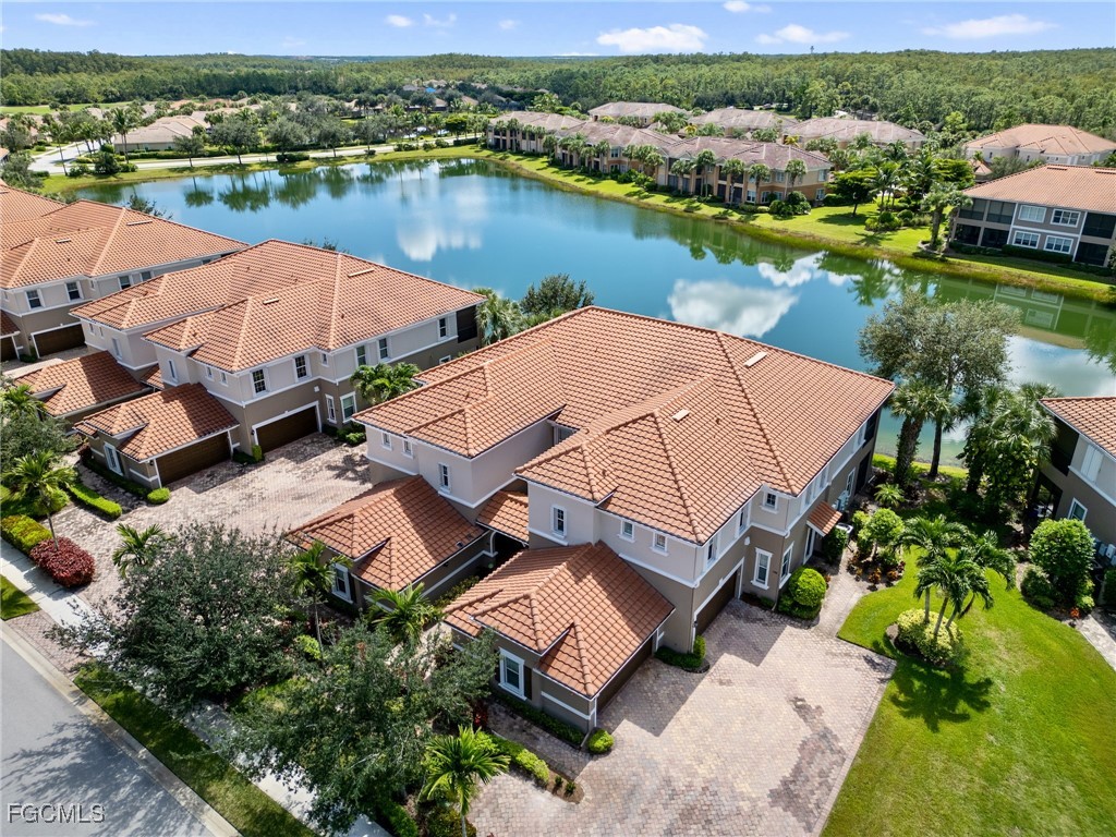 10260 Glastonbury Circle, Unit 102 Fort Myers, FL 33913 - Photo 35 of 44 an aerial view of a house with outdoor space lake view and an ocean view