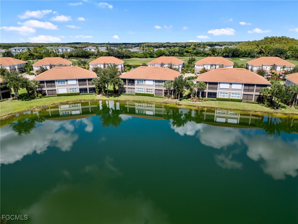 10260 Glastonbury Circle, Unit 102 Fort Myers, FL 33913 - Photo 38 of 44 a view of a lake with a city view