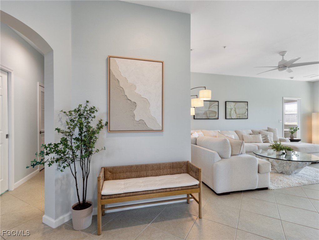 10260 Glastonbury Circle, Unit 102 Fort Myers, FL 33913 - Photo 4 of 44 a living room with furniture flowerpot and a potted plant