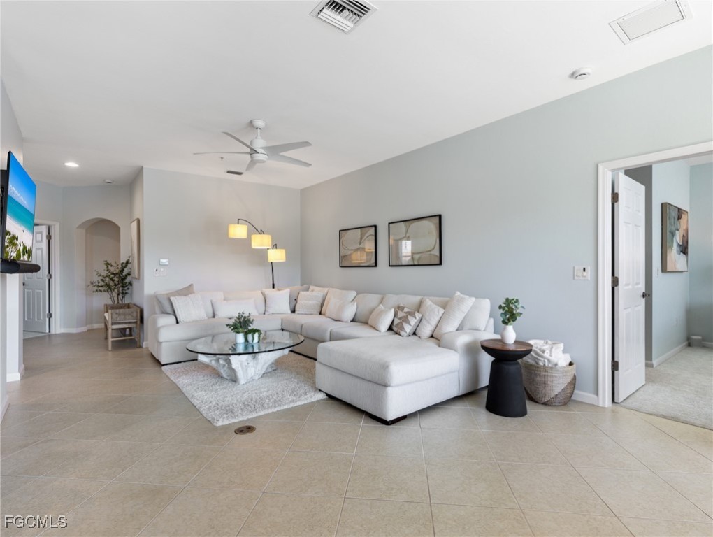 10260 Glastonbury Circle, Unit 102 Fort Myers, FL 33913 - Photo 6 of 44 a living room with furniture and white walls