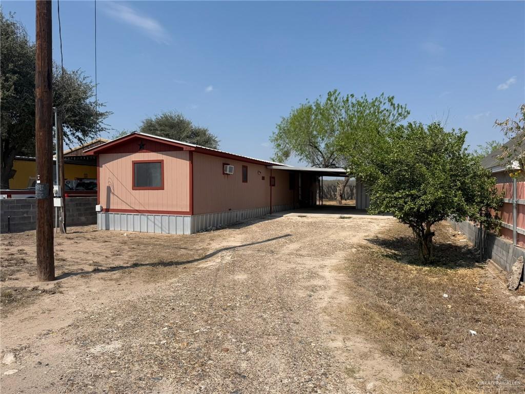 1814 Canyon Street Rio Grande City, TX 78582 - Photo 2 of 9 a front view of a house with a yard and garage