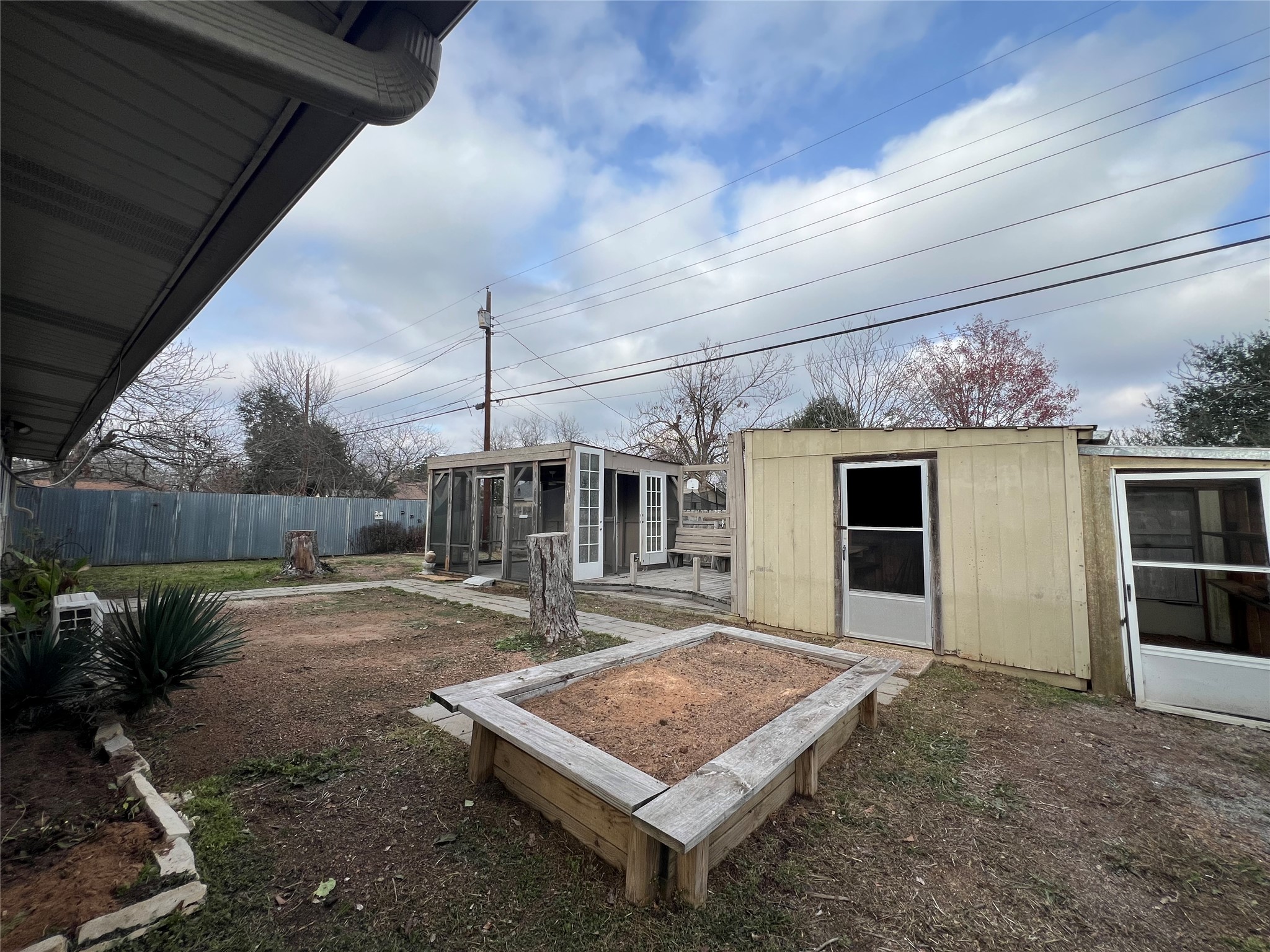 2204 Smith Avenue Taylor, TX 76574 - Photo 38 of 40 Raised Garden Bed, tool shed, and small green house