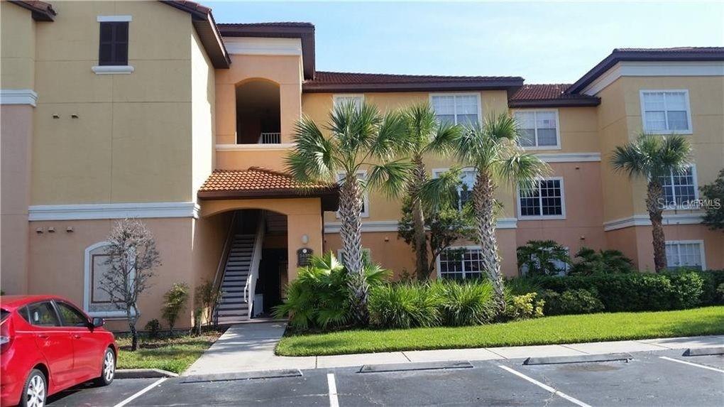5451 Vineland Road, Unit 2307 Orlando, FL 32811 - Photo 1 of 1 a front view of a house with garden