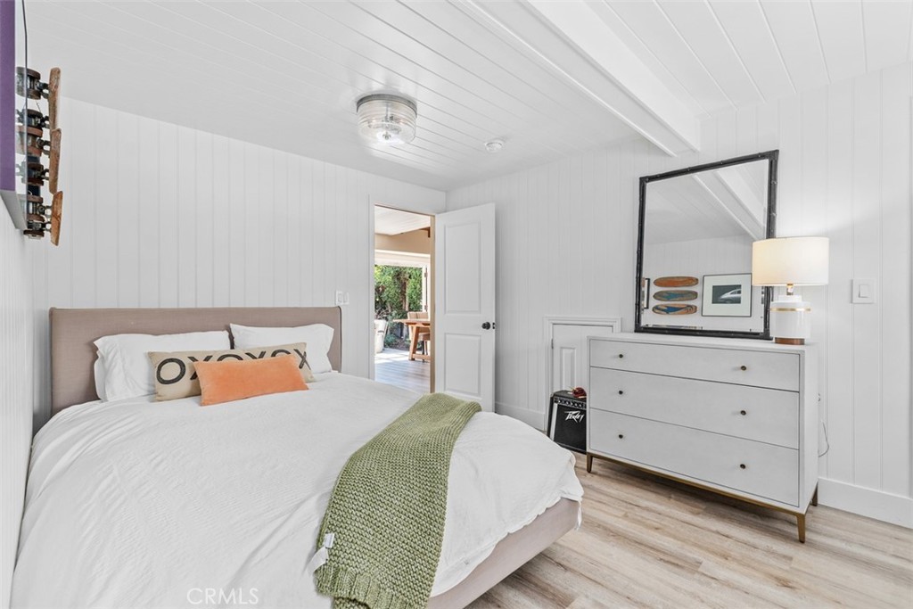 455 Brooks Street Laguna Beach, CA 92651 - Photo 18 of 32 a bedroom with a bed and a dresser
