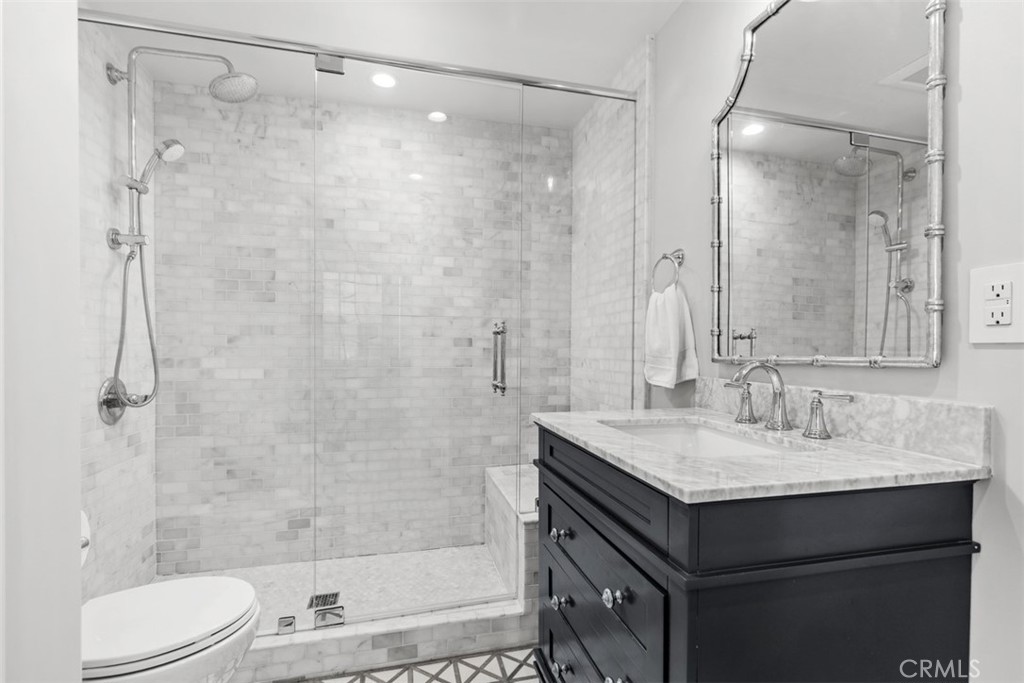 455 Brooks Street Laguna Beach, CA 92651 - Photo 20 of 32 a bathroom with a sink shower and a mirror