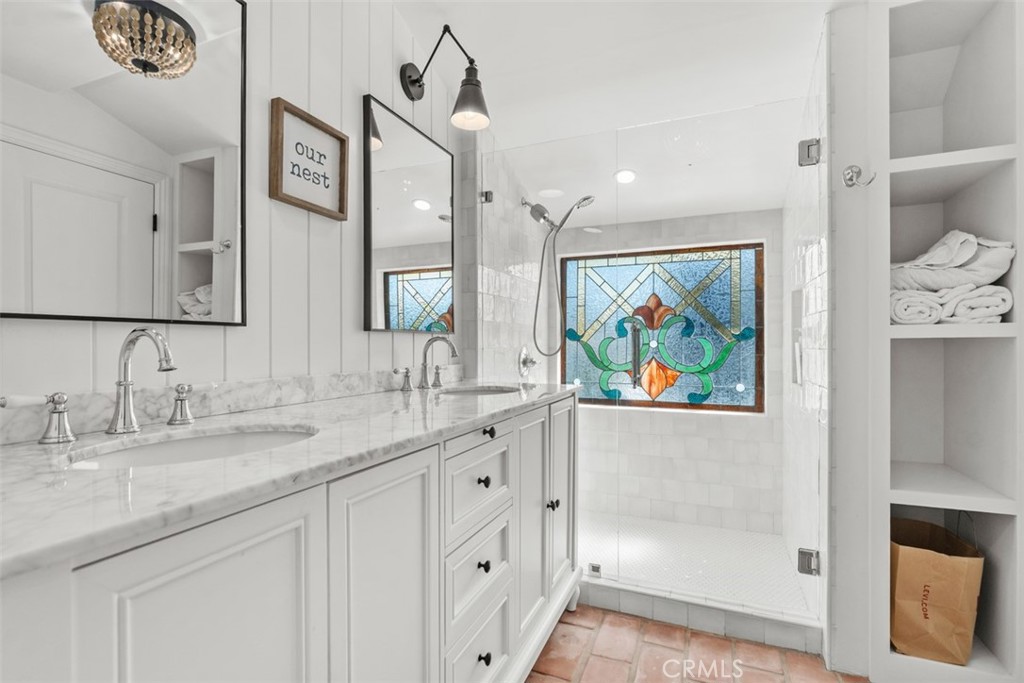 455 Brooks Street Laguna Beach, CA 92651 - Photo 23 of 32 a bathroom with a double vanity sink mirror and double