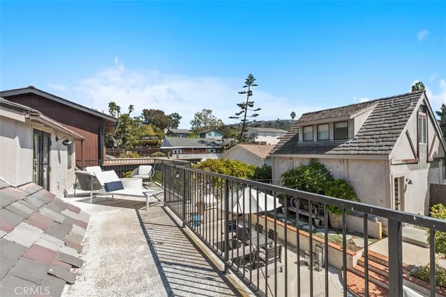 a view of a balcony with chairs