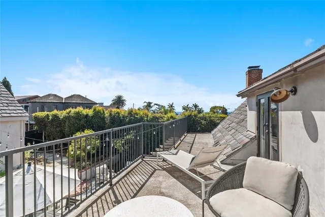 a view of a balcony with furniture