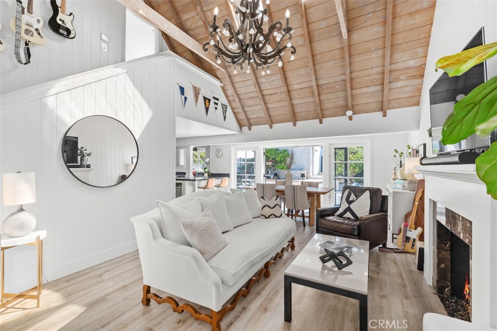 455 Brooks Street Laguna Beach, CA 92651 - Photo 6 of 32 a living room with fireplace furniture and a large window