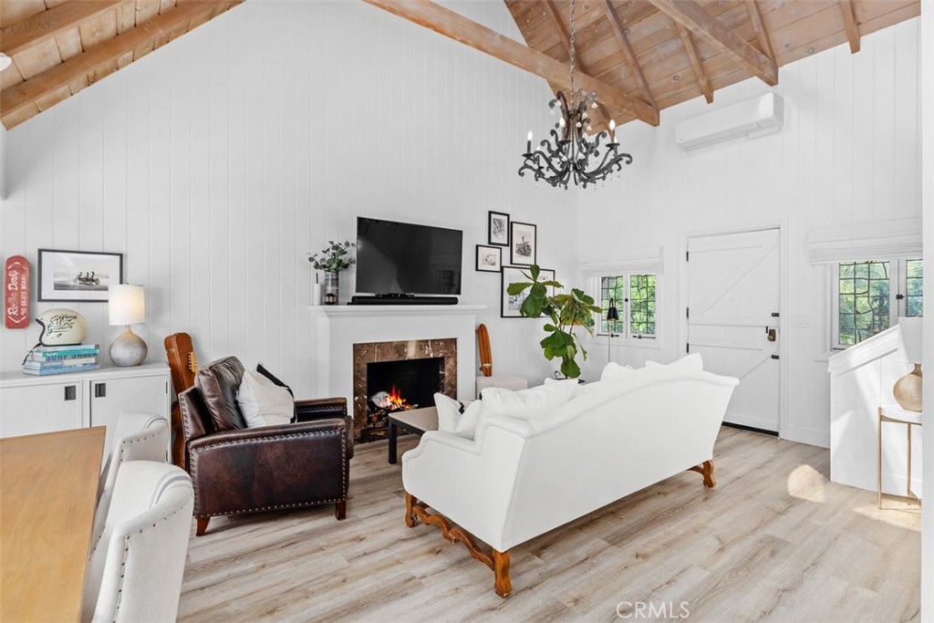 455 Brooks Street Laguna Beach, CA 92651 - Photo 7 of 32 a living room with furniture fireplace and flat screen tv