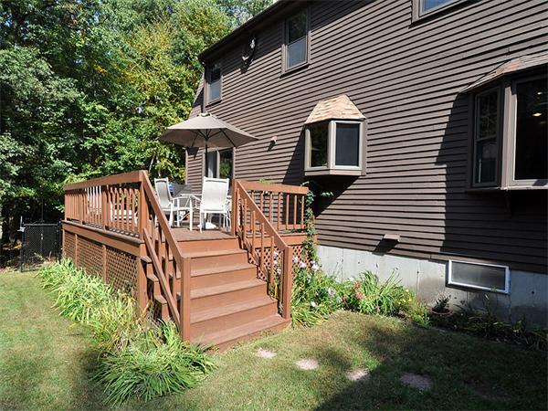 112 Prescott Road Boxborough, MA 01719 - Photo 25 of 30 a view of a house with backyard and wooden fence