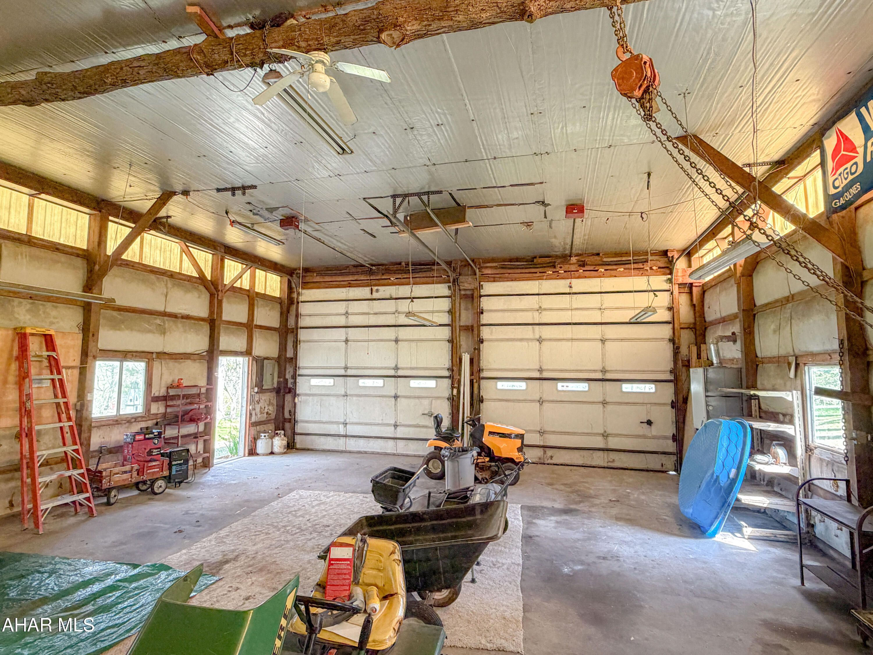 151 Pine Echo Road Everett, PA 15537 - Photo 42 of 51 a room with furniture gym equipment and large windows