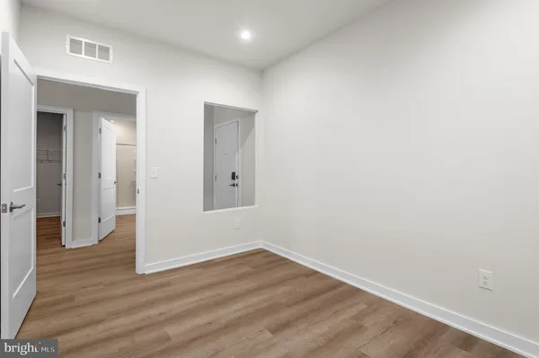 a bathroom with a double vanity sink toilet and shower