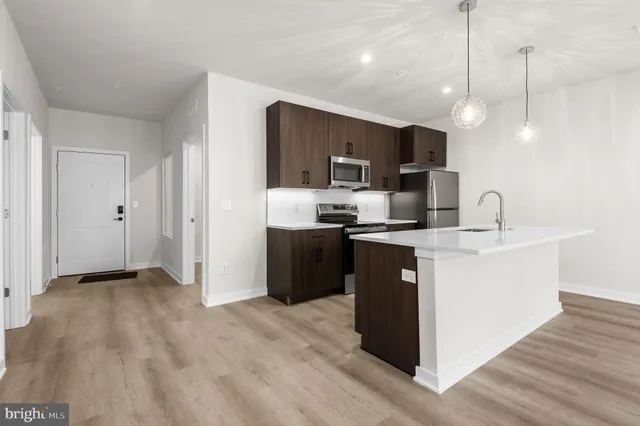 a view of kitchen with wooden floor