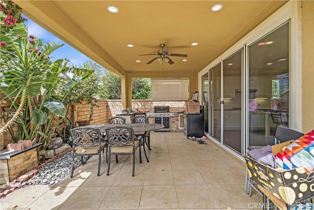 3380 Pine Ridge Loop Ontario, CA 91761 - Photo 30 of 37 a outdoor space with lots of tables a garden view and living room view