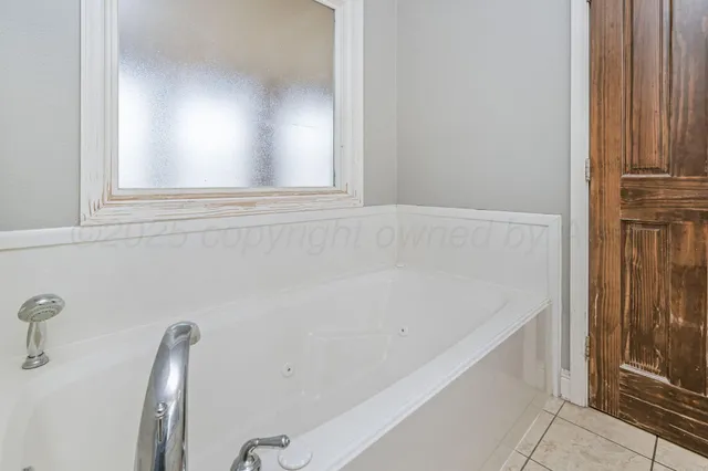 a bathroom with a bathtub