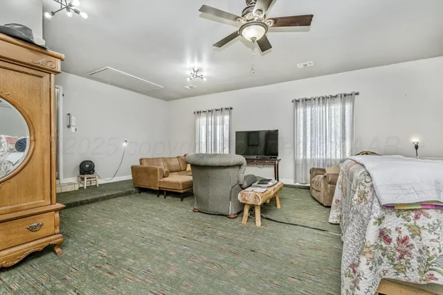 a bedroom with furniture and a window