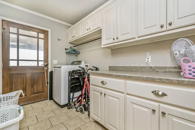 a view of a refrigerator and cabinets