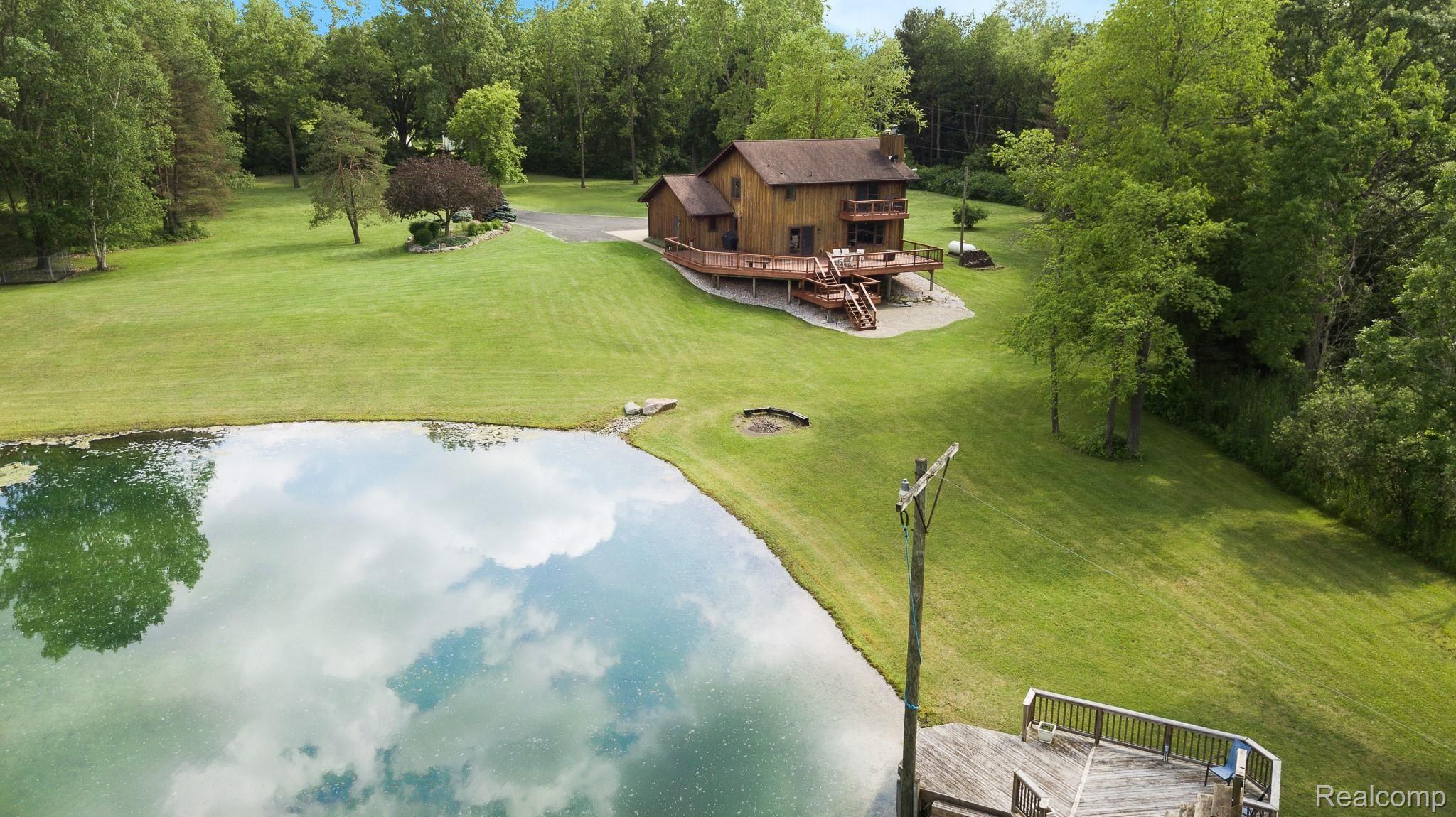 225 Brewer Road Leonard, MI 48367 - Photo 26 of 36 stocked pond.jpg
