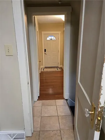 a view of a hallway and wooden floor
