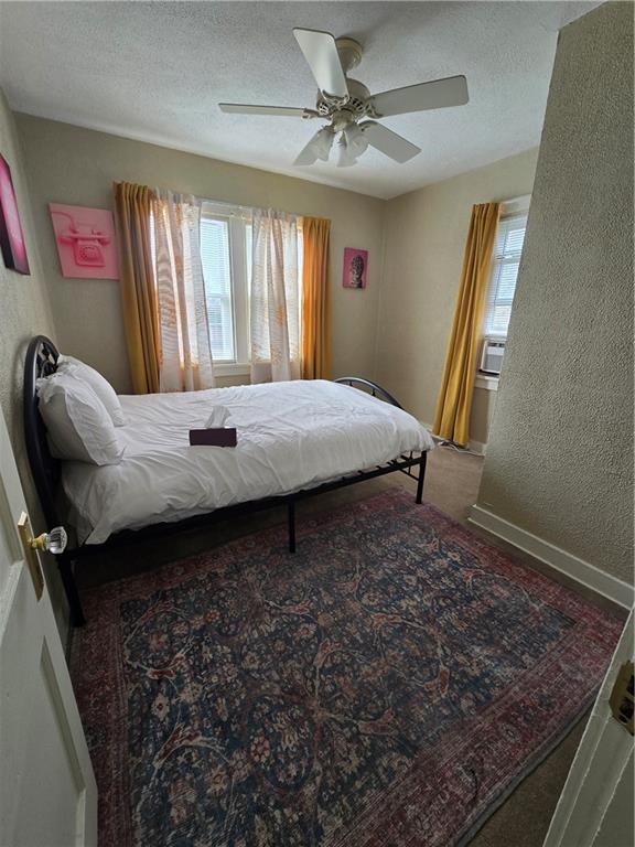 6501 Deary Street Pittsburgh, PA 15206 - Photo 24 of 47 a bed sitting in a room next to a window