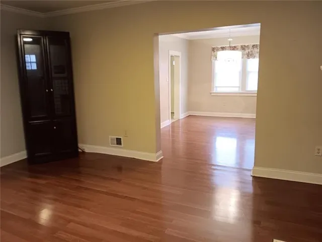 a kitchen with a refrigerator and cabinets