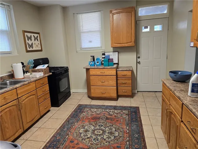 a kitchen with a stove and cabinets
