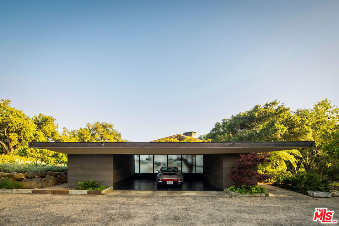 650 San Ysidro Road Santa Barbara, CA 93108 - Photo 12 of 55 a front view of a house with a garden