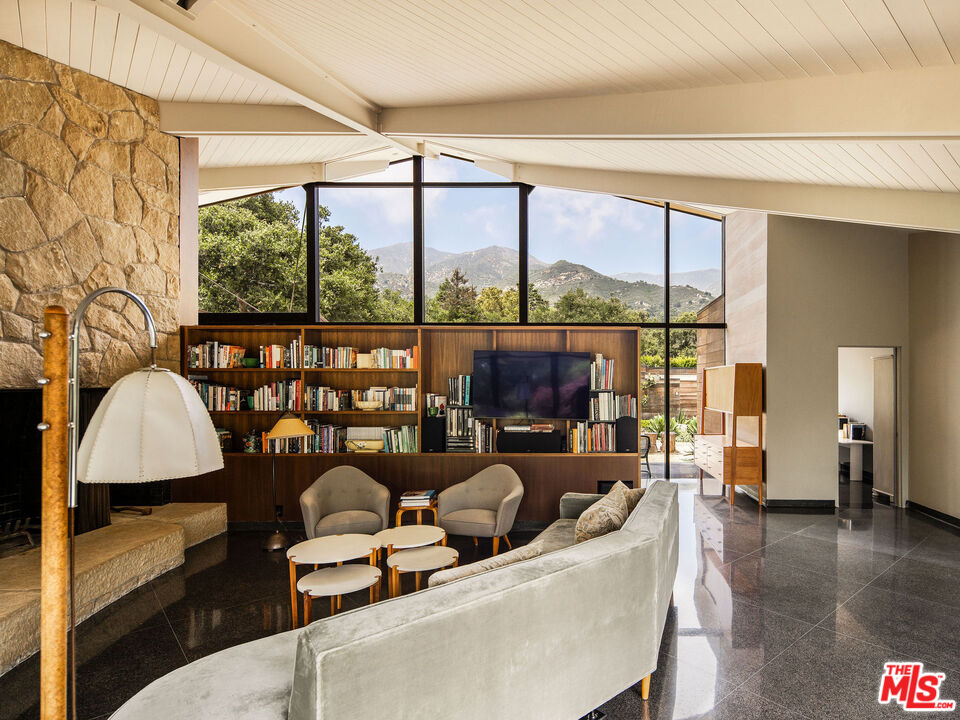 650 San Ysidro Road Santa Barbara, CA 93108 - Photo 18 of 55 a living room with fireplace furniture and a large window