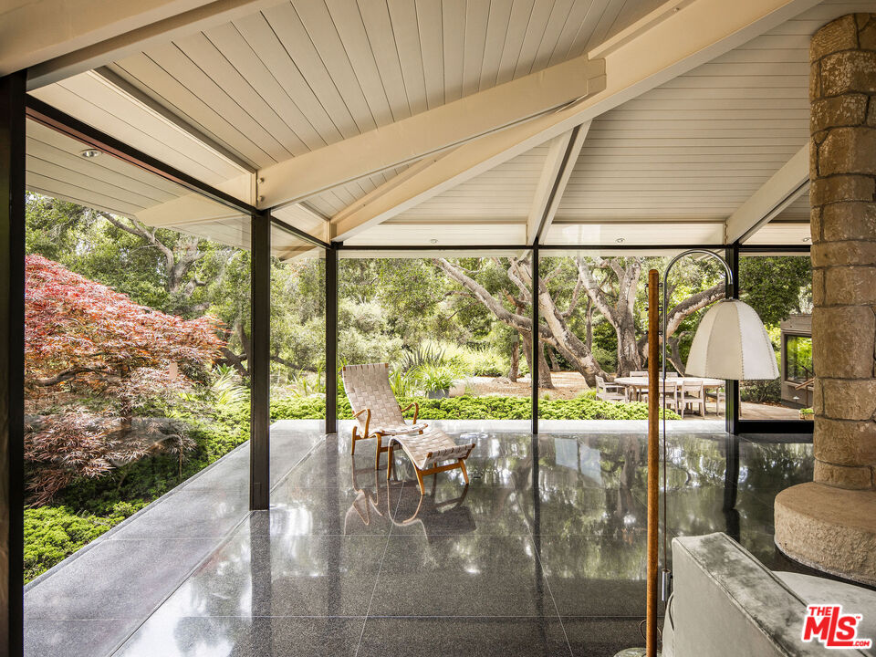 650 San Ysidro Road Santa Barbara, CA 93108 - Photo 22 of 55 a view of a porch with a backyard