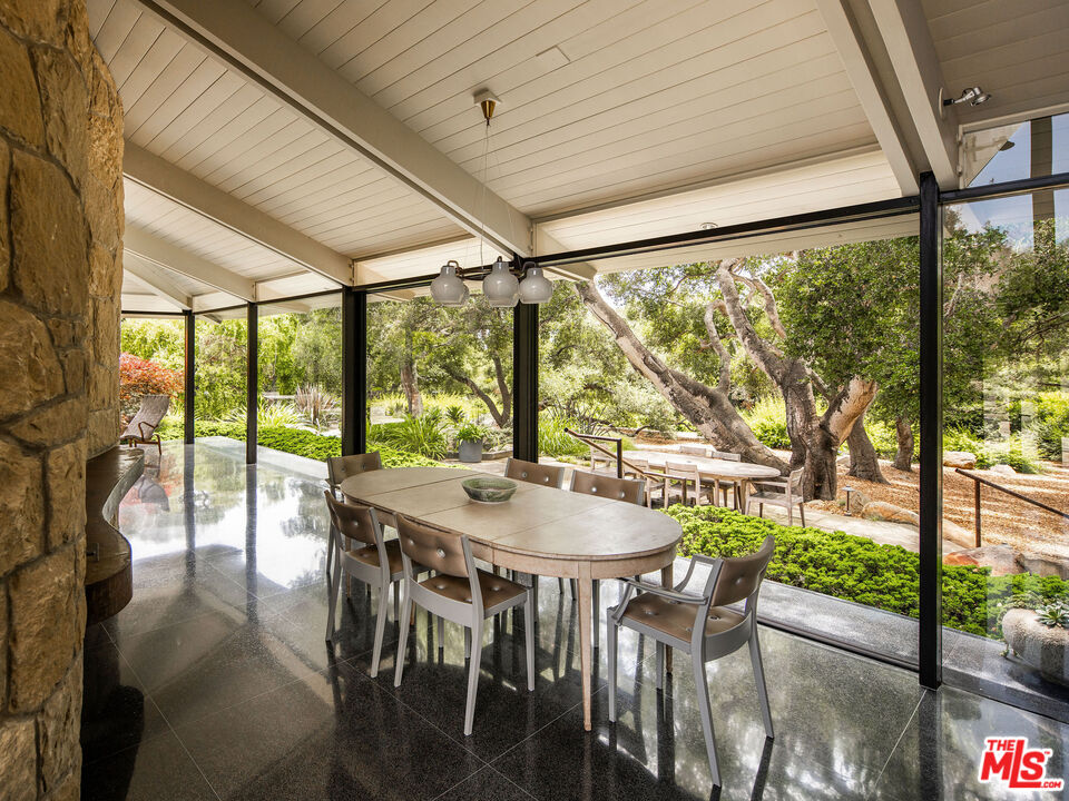 650 San Ysidro Road Santa Barbara, CA 93108 - Photo 23 of 55 a view of a dining room with furniture window and outside view