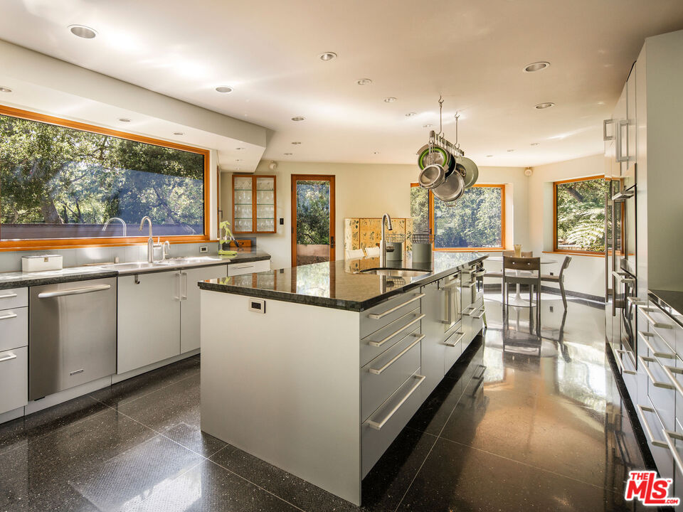 650 San Ysidro Road Santa Barbara, CA 93108 - Photo 24 of 55 a kitchen with counter top space and a sink