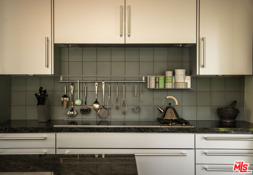 650 San Ysidro Road Santa Barbara, CA 93108 - Photo 25 of 55 a kitchen with a stove and cabinets