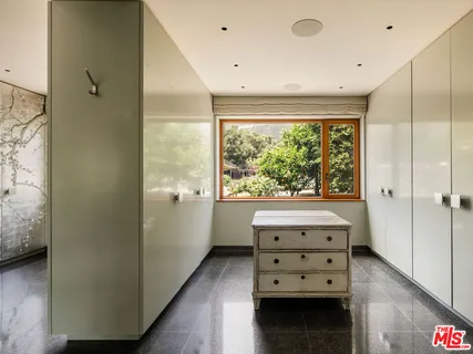 a room with furniture and a window