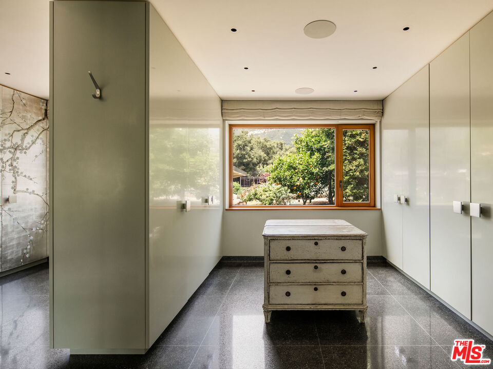 650 San Ysidro Road Santa Barbara, CA 93108 - Photo 29 of 55 a view of hallway with a large window and wooden floor