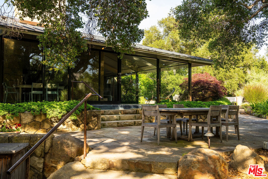 650 San Ysidro Road Santa Barbara, CA 93108 - Photo 33 of 55 a view of house with backyard outdoor seating and green space