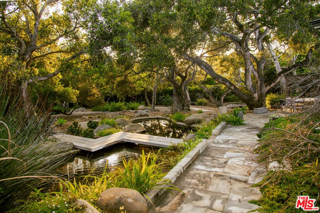 650 San Ysidro Road Santa Barbara, CA 93108 - Photo 35 of 55 a view of swimming pool with lawn chairs and plants